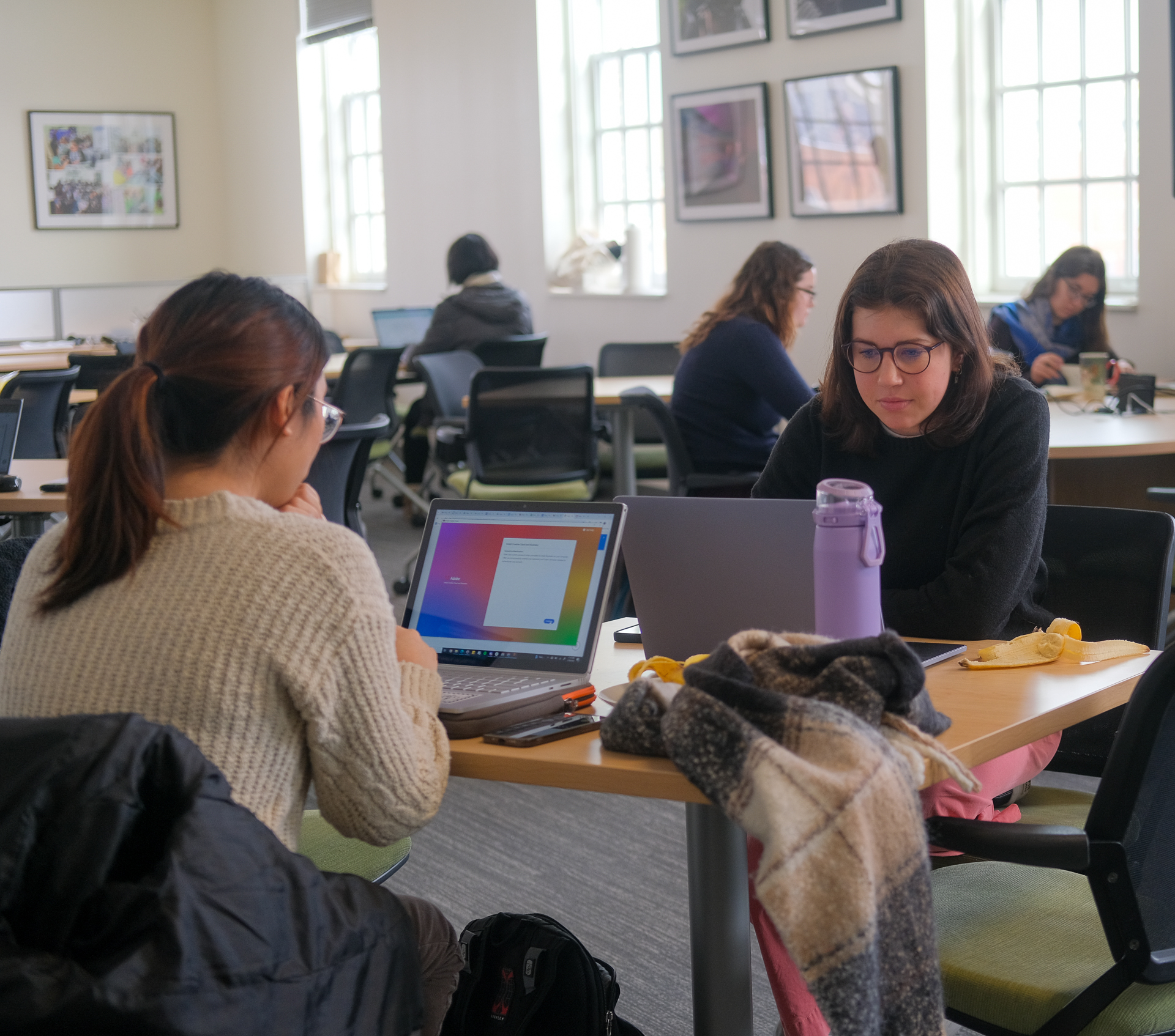 Students work on their laptops in the Language Science Center