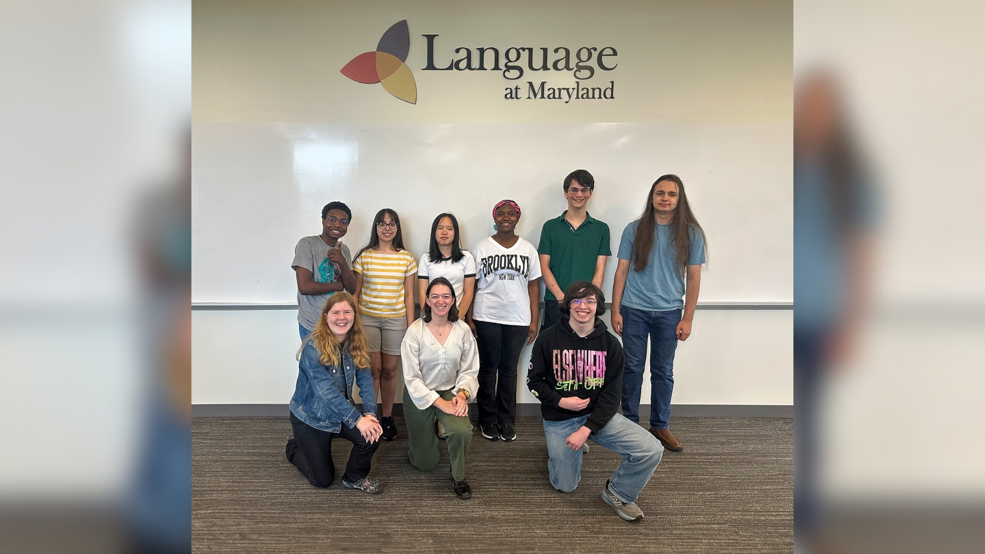 Students stand with course instructor Emily Lord